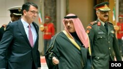 Secretary of Defense Ashton Carter walks with Kuwait's Deputy Prime Minister and Minister of Defense Sheikh Khaled Al-Jarrah Al-Sabah to attend a meeting with the Amir of Kuwait Sabah Al-Ahmad Al-Jaber Al-Sabah in Kuwait City, Kuwait, Feb. 23, 2015.