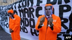 FILE - Protestors celebrate outside the U.S. District Court Southern District of New York after Tony Hernandez, brother of the president of Honduras Juan Orlando Hernandez, was sentenced to life for drug trafficking offenses, March 30, 2021.