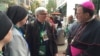 Clergy and nuns gather outside the World Meeting of Families the day before Pope Francis is due to visit the City of Brotherly Love, Philadelphia, Pennsylvania, Sept. 25, 2015. (J. Socolovsky/VOA)