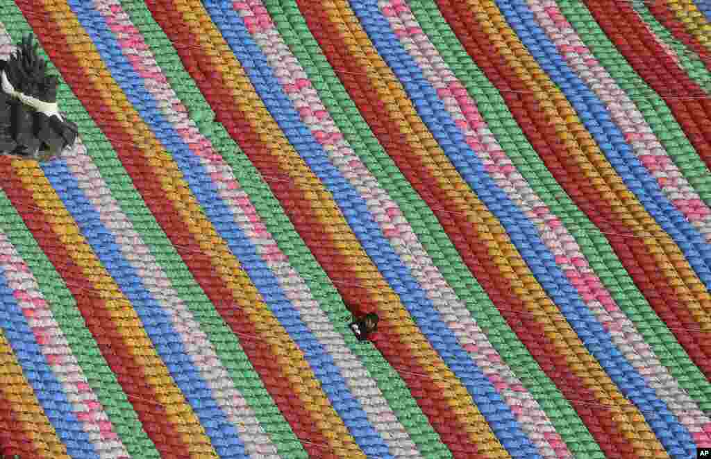 A worker fixes lanterns for the upcoming celebration of Buddha&#39;s birthday, at Jogye temple in Seoul, South Korea.