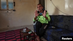 Unemployed Lebanese Hussein Hamadeh speaks during an interview with Reuters inside his home in Beirut's southern area of Ouzai, Lebanon on November 15, 2022. (REUTERS/Mohamed Azakir)