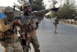 Afghan special forces patrol a deserted street during fighting with Taliban fighters, in Lashkar Gah, Helmand province, southern Afghanistan, Aug. 3, 2021.