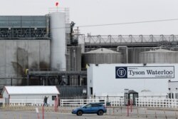 A worker leaves the Tyson Foods plant in Waterloo, Iowa, May 1, 2020. The coronavirus is devastating the nation’s meatpacking communities — places like Waterloo and Sioux City in Iowa; Grand Island, Nebraska; and Worthington, Minnesota.