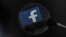 Facebook, whose logo is seen on a smartphone in this file photo, said Wednesday that it is aware of outages on its platforms including Facebook, Messenger and Instagram.