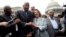 From left, House Assistant Minority Leader James Clyburn, Rep. John Lewis, D-Ga., Rep. Joseph Crowley, D-N.Y., House Minority Leader Nancy Pelosi of California, and Rep. Charles Rangel, D-N.Y., sing "We Shall Overcome" on Capitol Hill, in Washington, June
