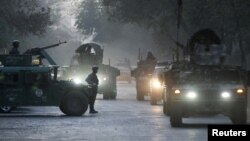 Afghan security forces leave the site of an incident after an attack at the University of Kabul, Afghanistan November 2, 2020. (REUTERS/Omar Sobhani)
