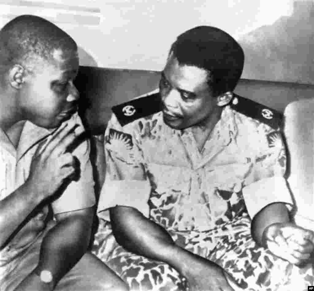 Lt. Col. Philip Effiong, right, acting head of state who announced the formal surrender of Biafra, talks in Owerri, Biafra's last stronghold, to Col. Olusegun Obasanjo, who accepted the field surrender of Biafra's armed forces, Jan. 15, 1970.