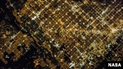 'Super View' of Glendale and Phoenix, Arizona, an image taken by a crew member of the Expedition 35 on the International Space Center. Cities in the image include Phoenix proper (right), Glendale (center), and Peoria (left). 