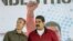 Venezuelan President Nicolas Maduro (R) and his Vice En la lista de sancionados destaca además de Maduro, el vicepresidente ejecutivo, Tareck El Aissami, quien cuestionó que se refieran a Venezuela como dictadura cuando la oposición se prepara para participar en un proceso electoral el próximo 15 de octubre.