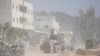 An Israeli army bulldozer operates at the parameter of the Nur Shams refugee camp during the ongoing army operation, in the West Bank city of Tulkarem, Oct. 31, 2024. 