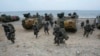 FILE - South Korean marines run out from amphibious assault vehicles after landing on the beach during a combined military amphibious landing exercise between South Korea and the U.S., in Pohang, South Korea, Sept. 2, 2024.