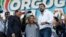 FILE - From left, Silvio Berlusconi, Giorgia Meloni and Matteo Salvini address a rally in Rome, Oct. 19, 2019. Thousands of protesters gathered in Rome for a so-called "Italian Pride" rally., 