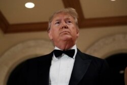 President Donald Trump stands in front of the media while talking about the situation at the U.S. embassy in Baghdad, from his Mar-a-Lago property, Dec. 31, 2019, in Palm Beach, Fla.