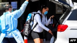 FILE - Australian tennis player Ivana Popovic leaves a hotel for a training session in Melbourne, Jan. 19, 2021, as players train while quarantining for two weeks ahead of the Australian Open tennis tournament.