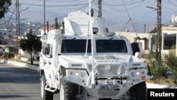 A UN peacekeepers (UNIFIL) vehicle drives in Marjayoun