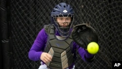FILE - James Madison University catcher Lauren Bernett during a NCAA softball game on Friday, May 28, 2021 in Columbia, Mo. She died of suicide recently. (AP Photo/Colin E. Braley)