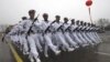 Chinese sailors march during a parade at a training base of China's North Sea Fleet (NSF) in Qingdao in east China's Shandong province on Monday, March 5, 2012. 