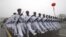 Chinese sailors march during a parade in Qingdao in east China's Shandong province, March 5, 2012. 