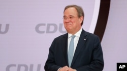 The new elected Christian Democratic Union, CDU, party chairman Armin Laschet stands on the podium after the voting at a digital party convention in Berlin, Germany, Jan. 16, 2021. (AP photo/Markus Schreiber)