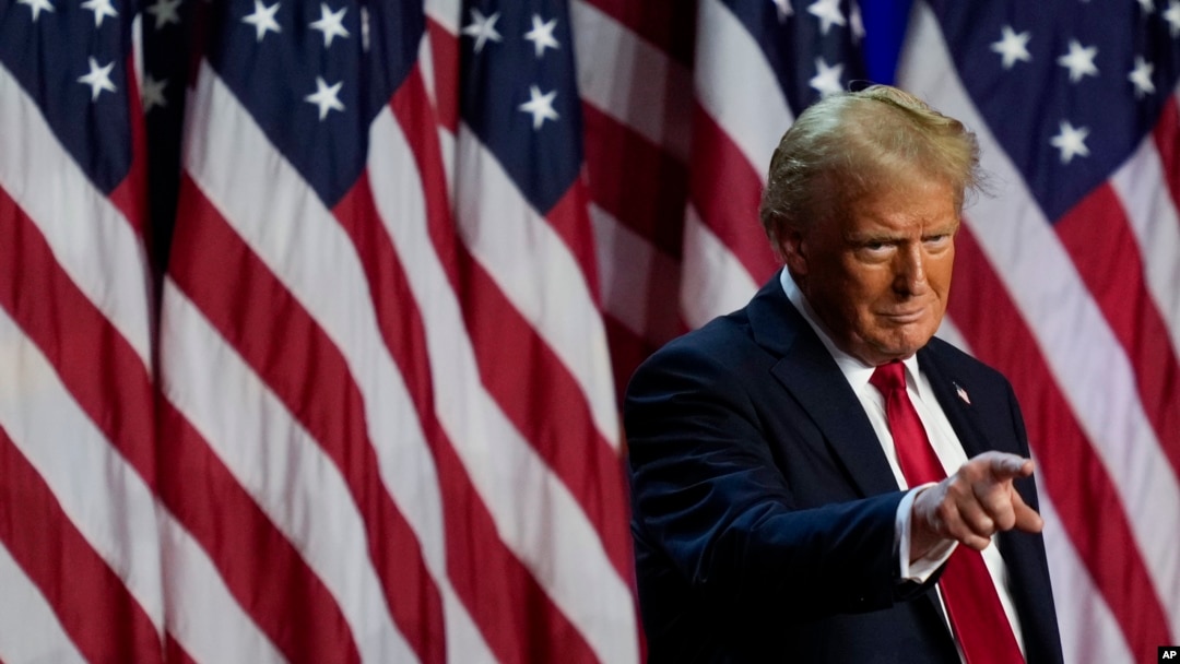 FILE - Republican presidential nominee former President Donald Trump points to the crowd at an election night watch party in West Palm Beach, Florida, Nov. 6, 2024.