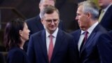 Germany's Foreign Minister Annalena Baerbock, NATO Secretary-General Jens Stoltenberg and Ukraine's Foreign Minister Dmytro Kuleba attend a meeting of the NATO-Ukraine Council together with Sweden at the Alliance's headquarters in Brussels, Nov. 29, 2023. 