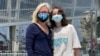 English Norman and her 12-year-old daughter, Jane Ellen Norman, pose for a photo in Atlanta on May 11, 2021, as Jane and her 14-year-old brother Owen were vaccinated after U.S. regulators expanded use of Pfizer's COVID-19 shot to those as young as 12.