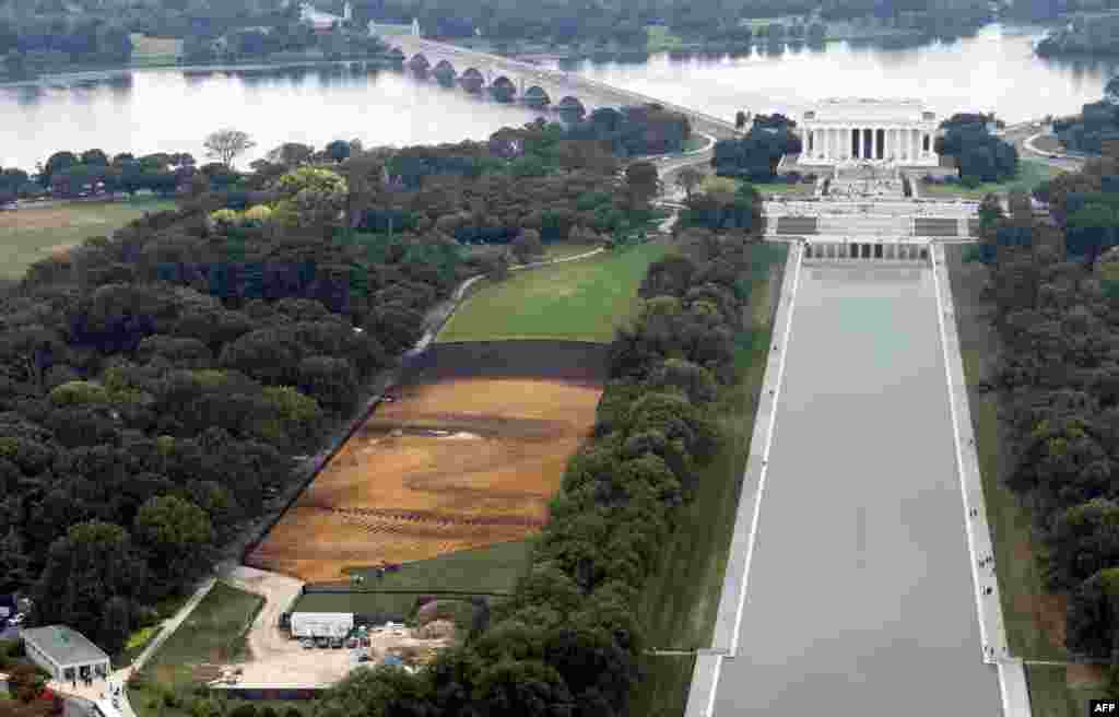 The landscape portrait, &quot;Out of Many, One&quot; by Cuban American artist Jorge Rodriguez-Gerada, appears on the National Mall in Washington, D.C. The 6-acre portrait will be on display until October 31.