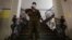 A soldier stands guard inside a polling station ahead of the upcoming presidential election in Santiago, Chile, Nov. 19, 2021. 