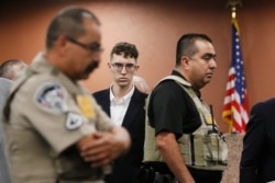 FILE - In the is Oct. 10, 2019 file photo, El Paso Walmart shooting suspect Patrick Crusius pleads not guilty during his arraignment in El Paso, Texas.
