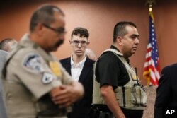 FILE - In the is Oct. 10, 2019 file photo, El Paso Walmart shooting suspect Patrick Crusius pleads not guilty during his arraignment in El Paso, Texas.