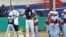 Tampa Bay Rays hitting coach Derek Shelton, left, and retired Cuban player Michel Ford (25) hold a baseball clinic for Cuban children the day before the Rays are to play an exhibition game against the Cuban National Team in Havana, Cuba, March 21, 2016. 