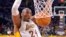 Los Angeles Lakers guard Kobe Bryant dunks during the first half of an NBA basketball game against the Indiana Pacers, Jan. 4, 2015, in Los Angeles, California.