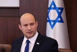 Israeli Prime Minister Naftali Bennett chairs the first weekly Cabinet meeting of the new government in Jerusalem, June 20, 2021.