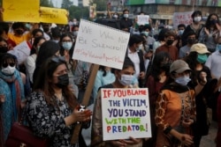 Women's rights activists demonstrate to condemn the violence against women in Lahore, Pakistan, Saturday, July 24, 2021.