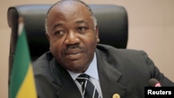 FILE - Gabon's President Ali Bongo Ondimba addresses a meeting on climate change at the 30th Ordinary Session of the Assembly of the Heads of State and the Government of the African Union in Addis Ababa, Ethiopia, Jan. 29, 2018.