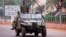 Seleka soldiers drive along a road in Bangui December 5, 2013.