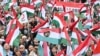 Supporters of the opposition 'TISZA' party protest against what they call "government propaganda" at the main state MTVA channel headquarters in Budapest, Hungary, Oct. 5, 2024.