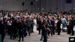 People gather during a stocktaking plenary session at the COP26 U.N. Climate Summit in Glasgow, Scotland, Britain, Nov. 13, 2021. Going into overtime, negotiators at the talks are still trying to find common ground on phasing out coal.