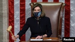 U.S. House Speaker Nancy Pelosi, D-Calif., presides over the vote to impeach President Donald Trump for a second time, a week after his supporters stormed the Capitol building, on the floor of the House of Representatives in Washington, Jan. 13, 2021. 