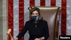 U.S. House Speaker Nancy Pelosi, D-Calif., presides over the vote to impeach President Donald Trump for a second time, a week after his supporters stormed the Capitol building, on the floor of the House of Representatives in Washington, Jan. 13, 2021. 