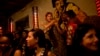 FILE - Women express themselves at a bar in Saint-Louis during the Senegalese city's annual jazz festival, May 18, 2013.