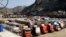 FILE - Trucks are parked at Pakistan-Afghanistan border Torkham, Oct. 19, 2018. 