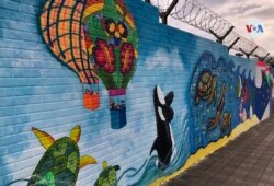 El mural fue elaborado por nueve artistas y 25 niños.  [Foto: Eugenia Sagastume, VOA]