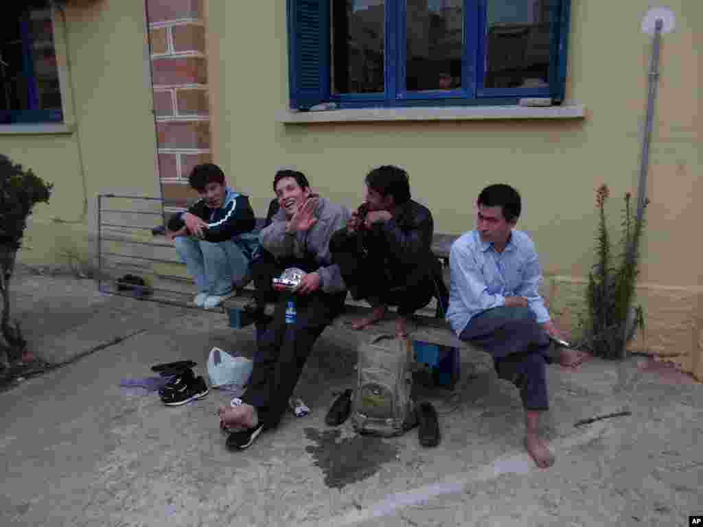 Illegal migrants who've crossed the Evros river into Greece waiting to board the train for Athens at Alexandroupolis, the biggest town near the border (VOA Photo H. Ridgwell)