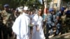 FILE - Yahya Jammeh arrives at a polling station with his wife Zineb during the presidential election in Banjul, Gambia, Dec. 1, 2016.