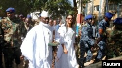 FILE - Yahya Jammeh arrives at a polling station with his wife Zineb during the presidential election in Banjul, Gambia, Dec. 1, 2016.