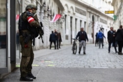 A military police officer stands guard near the scene of a terrorist attack in Vienna, Austria, Nov. 4, 2020.