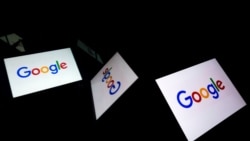 (FILES) This file illustration photo taken on February 18, 2019 shows the US multinational technology and Internet-related services company Google logo displayed on a tablet in Paris. - Google's cloud-hosted email service suffered a "significant"…