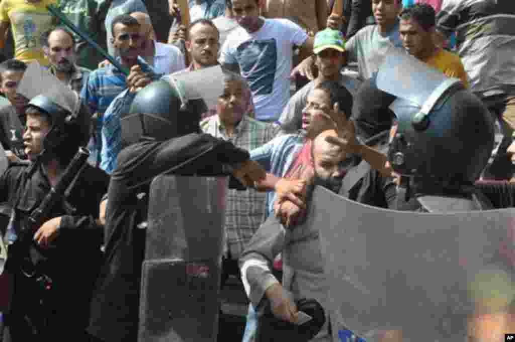 A Ukrainian soldier is pictured next to a tank near the village of Debaltseve in eastern Ukraine Sept. 21, 2014.