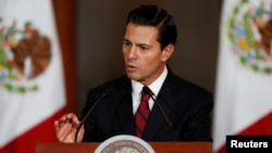 FILE - Mexico's President Enrique Pena Nieto speaks to the audience during a meeting with members of the Diplomatic Corps in Mexico City, Mexico.